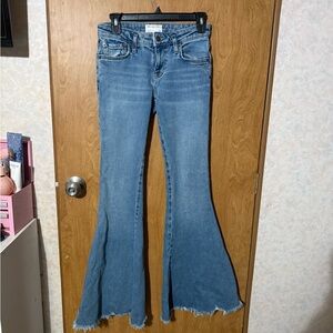 We The Free Medium Blue High-Rise Flare Jeans with Raw Hem please see photos